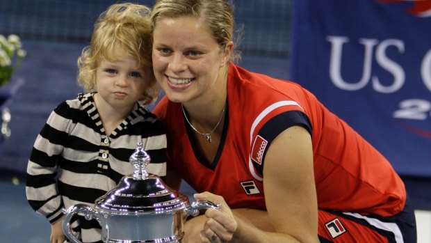 Kim Clijsters, of Belgium, poses with her daughter Jada and the championship trophy after winning the 2009 US Open.