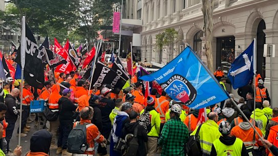 CFMEU workers march through Brisbane streets to protest safety concerns.