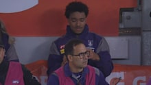 Brandon Walker in tears on the bench.