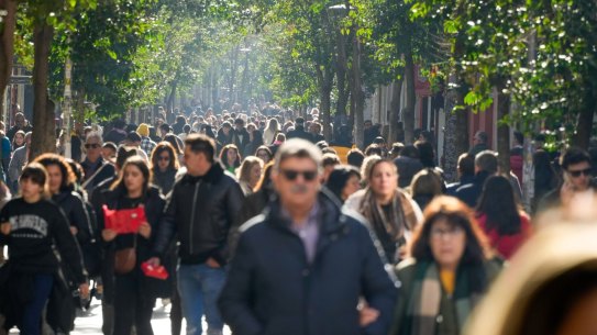 Crowds make their way along the pedestrian shopping area of Fuencarral street in central Madrid, Spain, on Wednesday.