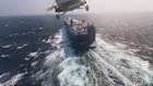 A Houthi forces helicopter seizing the cargo ship Galaxy Leader in the Red Sea in November 2023.
