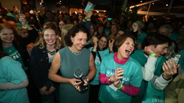 Independent Monique Ryan celebrates with supporters after winning the seat of Kooyong from Josh Frydenberg.