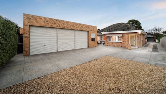 The three-car garage was the major drawcard for the home, otherwise in original condition.