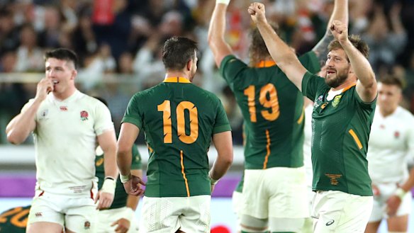 Handre Pollard and Frans Steyn celebrate after the final whistle blows.