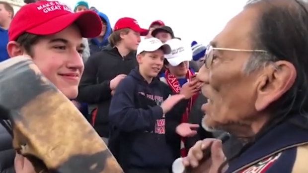 Native American Indian elder Nathan Phillips is taunted by Covington Catholic High School students wearing Make America Great Again caps near the Lincoln Memorial in Washington. 