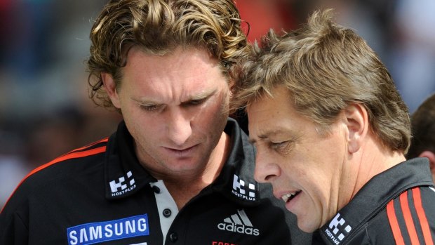 James Hird and Bomber Thompson working together in 2011. 