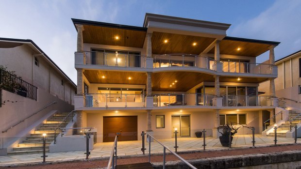 Perth billionaire Angela Bennett has three properties on the same street in Wannanup overlooking a canal. 