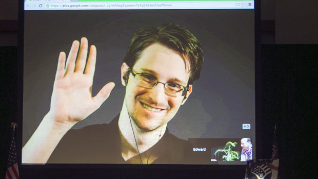 Edward Snowden appears via video link from Moscow at a civil liberties event in Hawaii in 2015. His leaks exposed the mass surveillance practices of the British and US governments, Five Eyes partners of Australia.