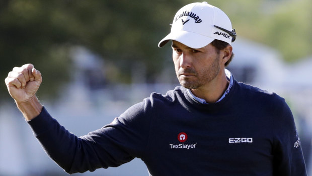 Kevin Kisner pumps his fist after making a putt on the 16th hole to defeat Matt Kuchar in the finals at the Match Play Championship golf tournament, in Austin, Texas. 