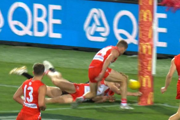 Callum Mills dives full length to put the ball through the Swans’ posts for a rushed behind.