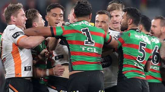 The Rabbitohs and Tigers match erupted early on after Josh Reynolds was put on report for dangerous tackle.