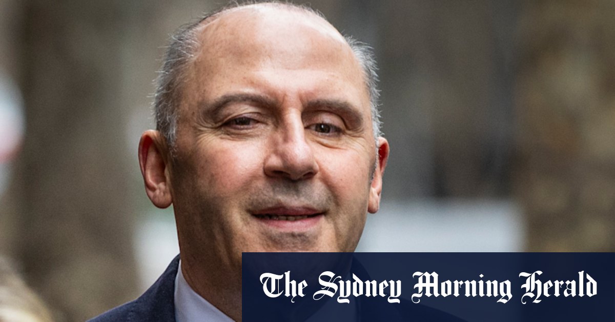 A smiling Tony Mokbel arrives at court in a tailored suit, looking to quash convictions