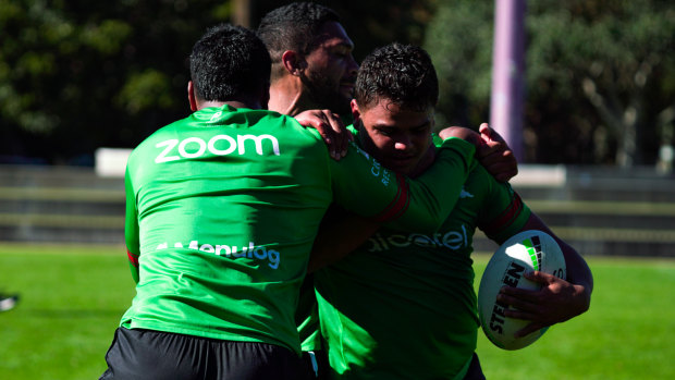Latrell Mitchell slogs it out during a brutal South Sydney field session on Tuesday.