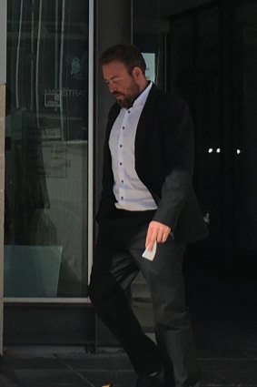 Christopher Hocking, 38, of Kaleen, leaves court where he faced a charge of bribery.