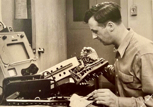 Fred Kenyon adjusting television equipment ahead of the 1951 Festival of Britain at London’s South Bank.