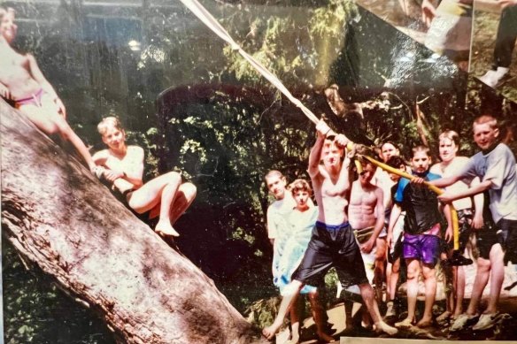 Doug Hendrie (holding rope) with friends at the Yarra in Eltham.