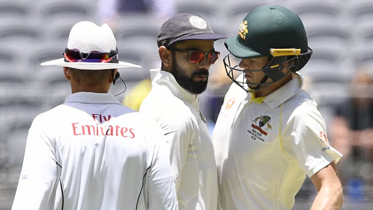 Up close and personal: Virat Kohli and Tim Paine exchange words in the second Test.