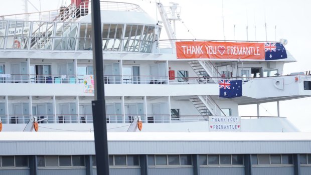 Cruise ship MS Artania which docked in Fremantle on Friday after news came to light that passengers and crew had contracted COVID-19, displayed a sign saying 'Thank you Fremantle' on Saturday.