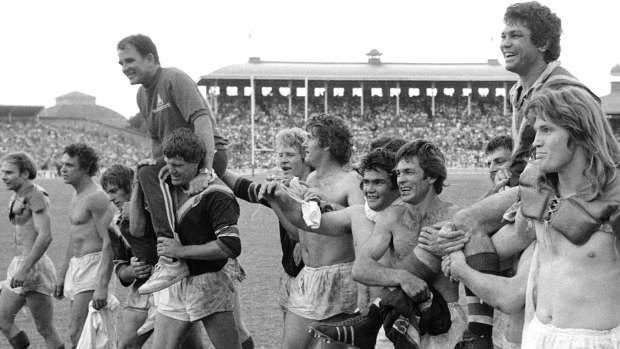Captain Arthur Beetson (right) and coach Jack Gibson are chaired off after the 1975 grand final.
