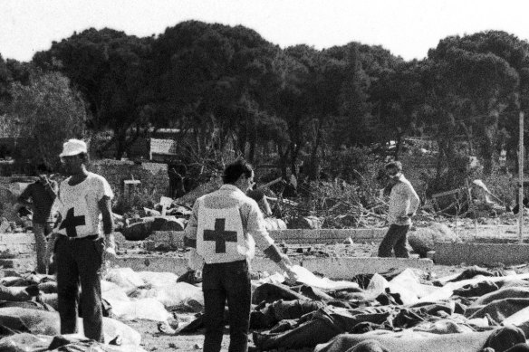 Red Cross and social workers at the Sabra camp work among the victims of the massacre.