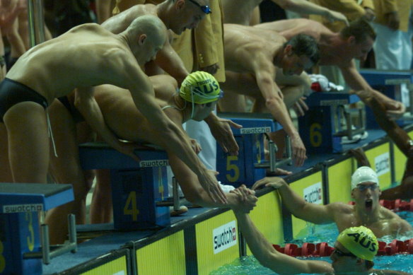 The victorious mens 4x 100m freestyle relay team of Michael Klim, Chris Fydler, Ashley Callus and Ian Thorpe.