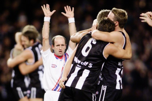 Collingwood celebrates victory over Brisbane.