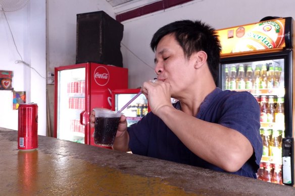 Duong Duc Toan, manager of the Nana Backpacker Hostel, drinking the local vodka he said he served the two Australians.