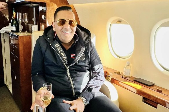 Sippy Grewal poses with champagne on a private jet.
