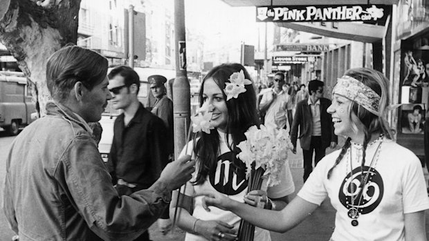 Peace, love and “flower power” was the mantra of the hippie generation: handing out daffodils to Kings Cross pedestrians in 1969.
