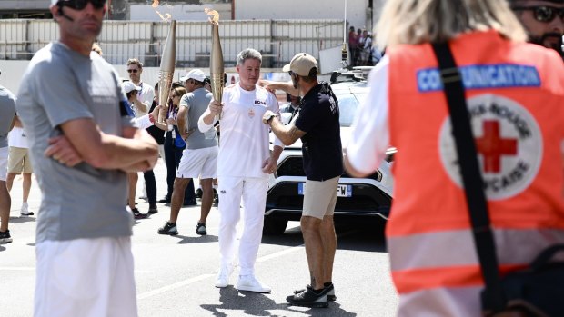 Nine CEO carries Olympic torch as journalists’ strike looms