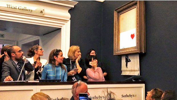 The scene at Sotheby's just after the Banksy sold for  £1 million. 
