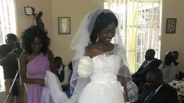 Zanele Ndlovu walks down the aisle on her wedding day at a hospital Chapel in Bulawayo, Zimbabwe. 