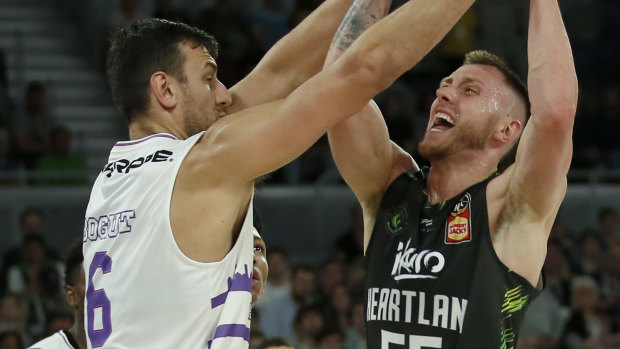 Mitch Creek of the Phoenix is guarded by the Kings' big man Andrew Bogut.