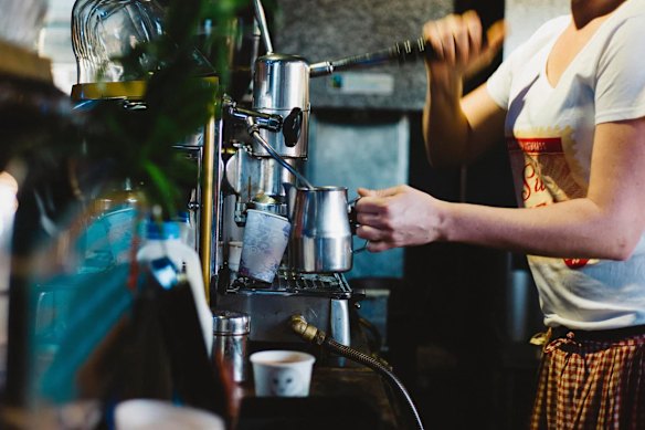 Coffees are made on a vintage espresso machine. 