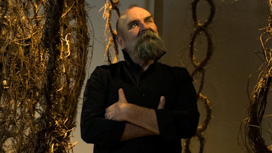 Linear exhibition designer Jacob Nash and curator Marcus Hughes, with artist Vicki West's work, Milaythina Takila (heart country), at the Powerhouse in Sydney.