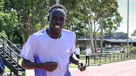 Australian runners Peter Bol and Gout Gout on the track together.