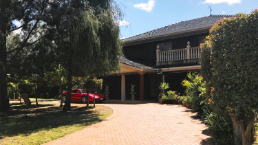 Nobody home: Pasquale Cufari's property in Mildura with a red Ferrari parked at the front.