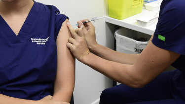 A Queensland Health nurse receives a COVID-19 vaccine. (File image)