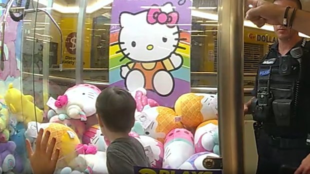 Ethan, 3, trapped in the skills tester claw machine at a Capalaba shopping centre.