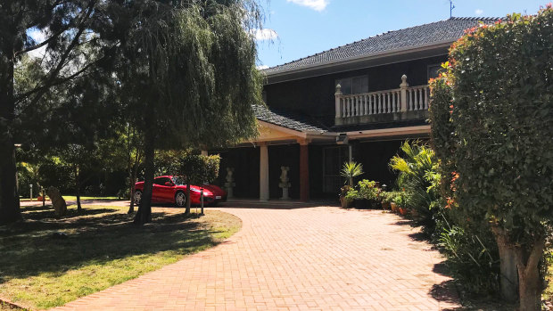 Pasquale Cufari's property in Mildura with a red Ferrari parked at the front.