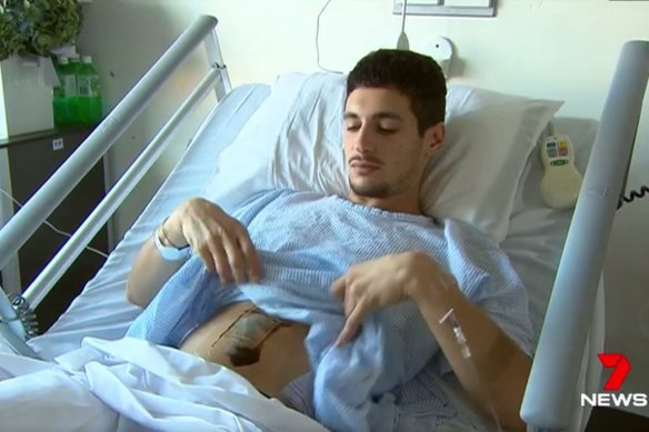 Luigi Spina shows his wound while in hospital in 2017. 