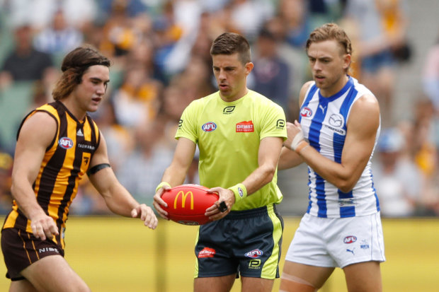 Umpire Michael Pell officiates during the round one AFL match between Hawthorn and North Melbourne at the MCG on March 20.