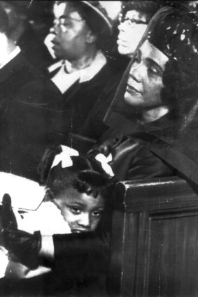 Coretta Scott King comforts her youngest daughter, Bernice, during the funeral service for her husband, Martin Luther King.