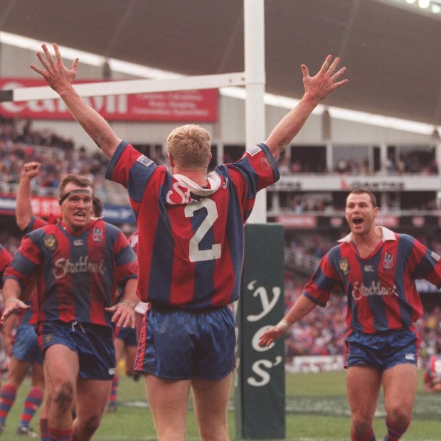 Iconic: Darren Albert scores for the Knights to win the 1997 grand final at the SFS.