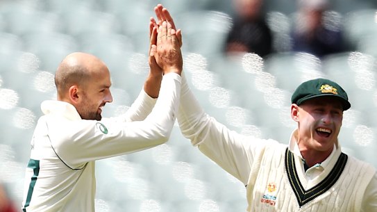 Hands up: Nathan Lyon runs riot on day four of the second Test with Pakistan. 