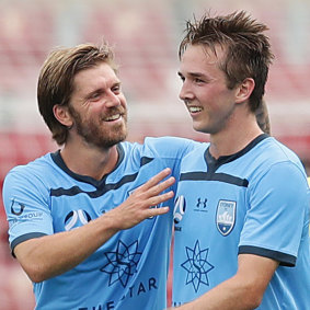 Calem Nieuwenhof celebrates his maiden senior goal with Luke Brattan, the player he's trying to model his game on.