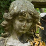 Angel guarding a grave at Highgate cemetery, London