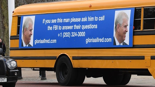 A yellow school bus with a message from US lawyer Gloria Allred for Prince Andrew drives towards Buckingham Palace in London in February.