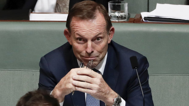 Former prime minister Tony Abbott listens as Prime Minister Malcolm Turnbull responds to a question on the National Energy Guarantee.