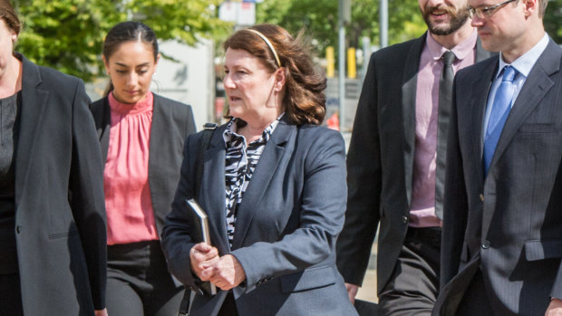 Melissa Beowulf (centre) and her sons Thorsten Halley Beowulf (far right) and Bjorn Toren Beowulf (not pictured), arrive at the ACT courts to face trial after being accused of murder.